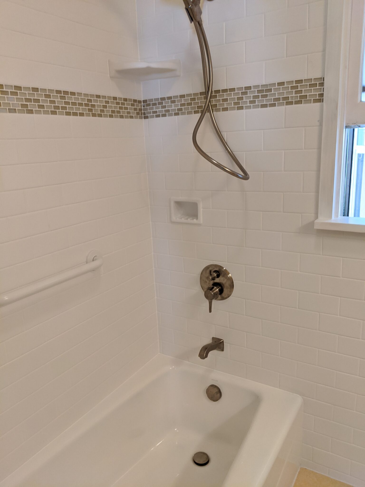 3x6 ceramic tile in a subway pattern with tile wainscot in North Park bathroom