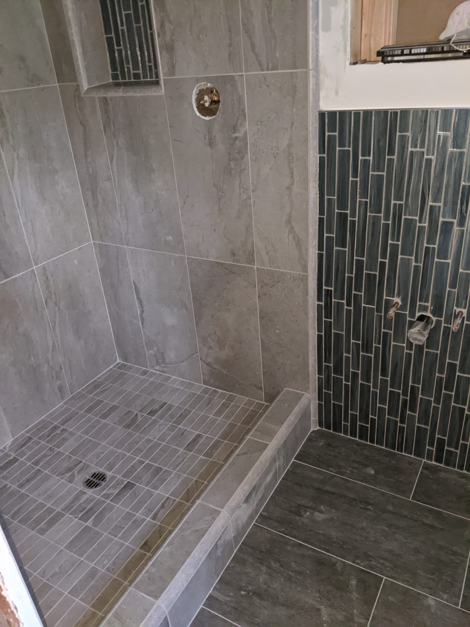 porcelain shower and floor with glass wainscot